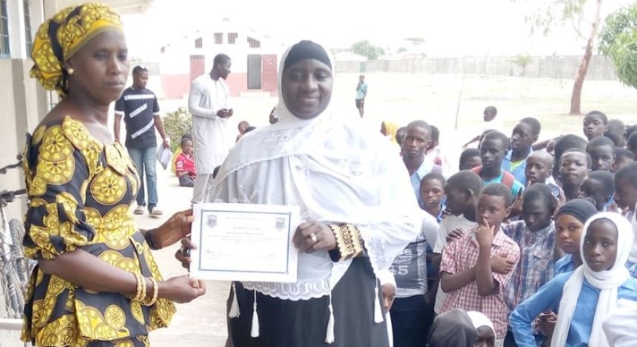 Fatou Gaye receiving Letter of Appreciation of Kunkujang Lower Basic School 2019