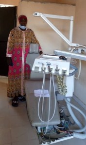 Fatou Gaye with dentist chair kind donation
